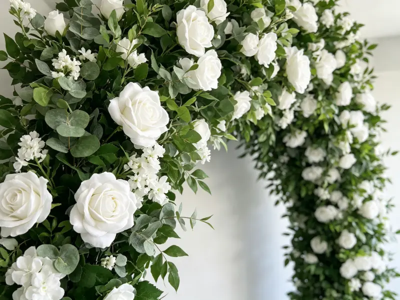 Close-up Detail of White Roses Delicate White Blooms and Lush Green Foliage on Spring Flower Arch