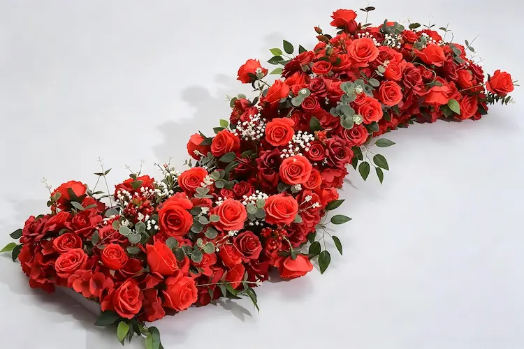 red artificial flower runner full view flat lay with roses and berries